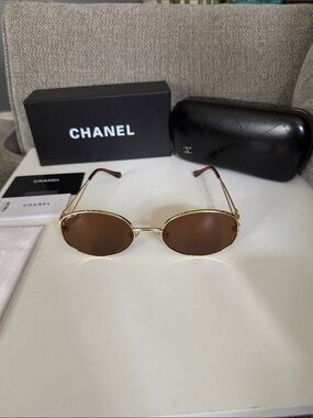 CHANEL Gold Frame Brown Lens Oval Sunglasses with Brown Temples and Logo Case